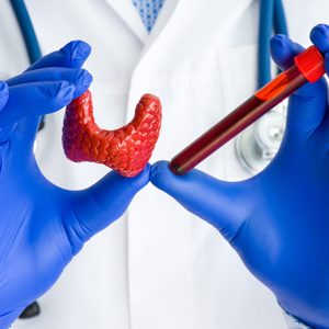 picture of gloved hands holding medical tools