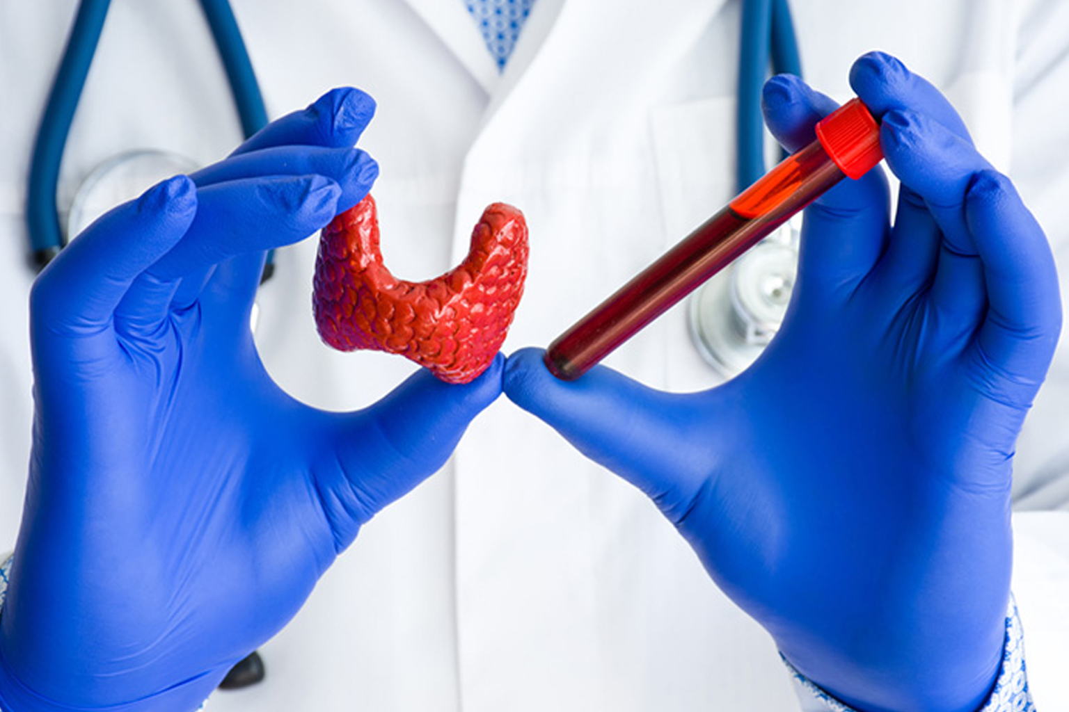 picture of gloved hands holding medical tools