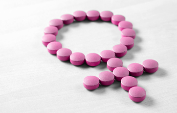 picture of pills in the shape of a female symbol in a smaller size